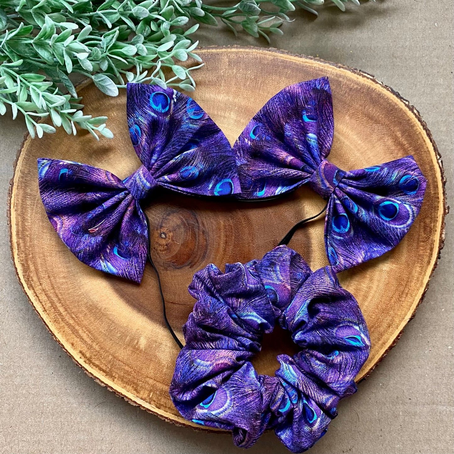 Peacock-colored cotton scrunchie from Bully Love Boutique with a soft, stretchy fabric and ruffled design.