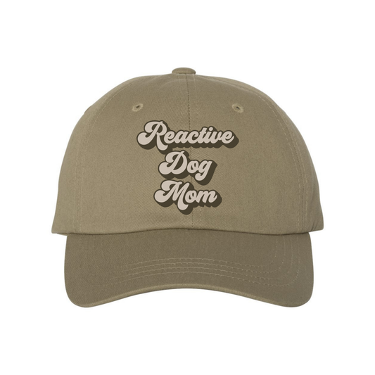 Reactive Dog Mom hat by Bully Love Boutique, beige fabric with black text and adjustable strap, casual accessory for dog moms.