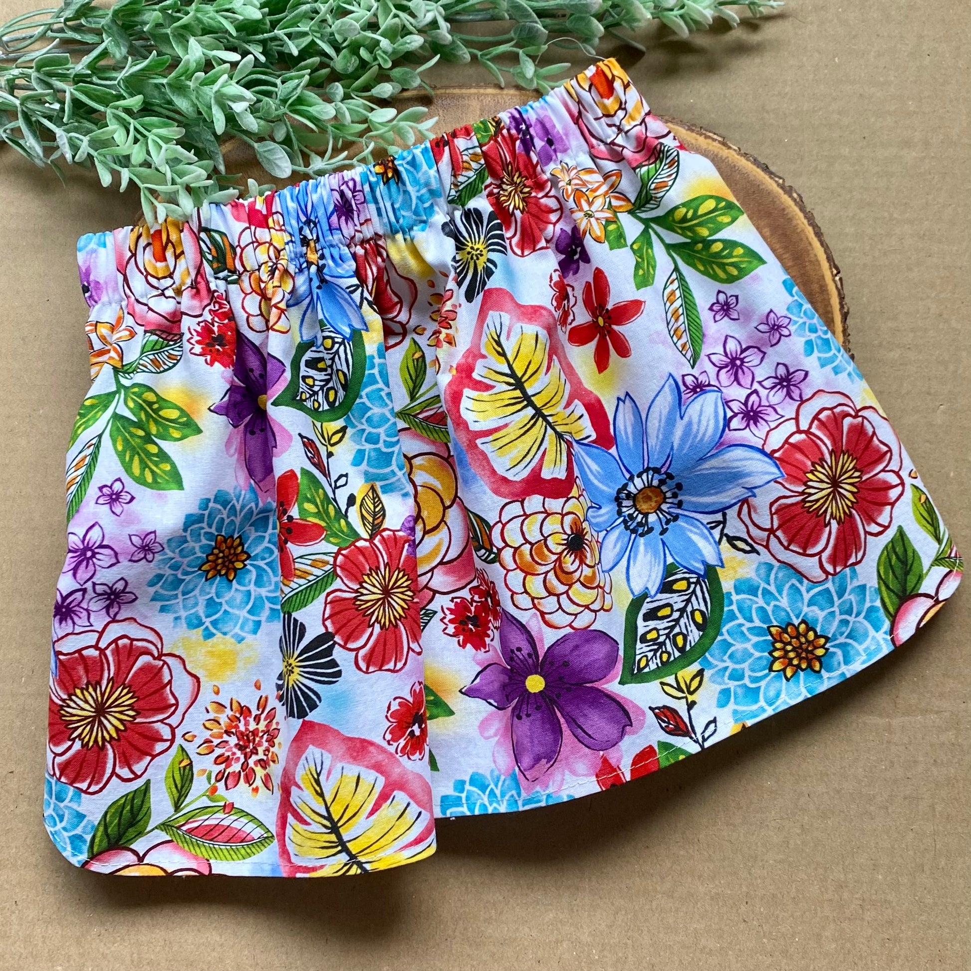 Summer Bouquet Dog Skirt by Bully Love Boutique features a colorful floral design on lightweight fabric, perfect for warm weather.