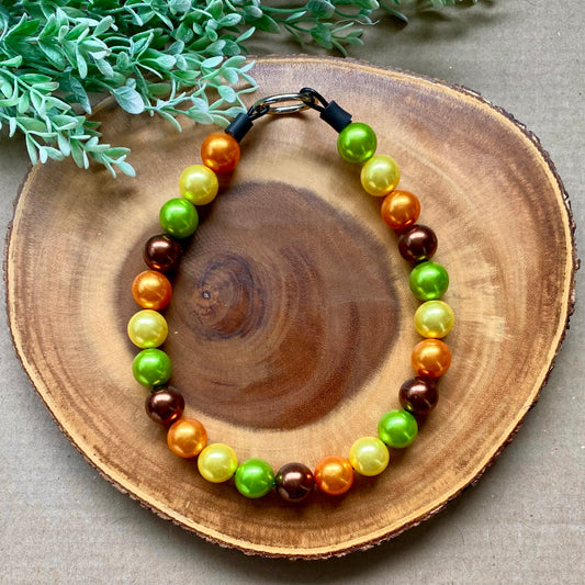 Golden Hour Bubblegum beaded dog collar by Bully Love Boutique featuring colorful beads and adjustable strap for pets.