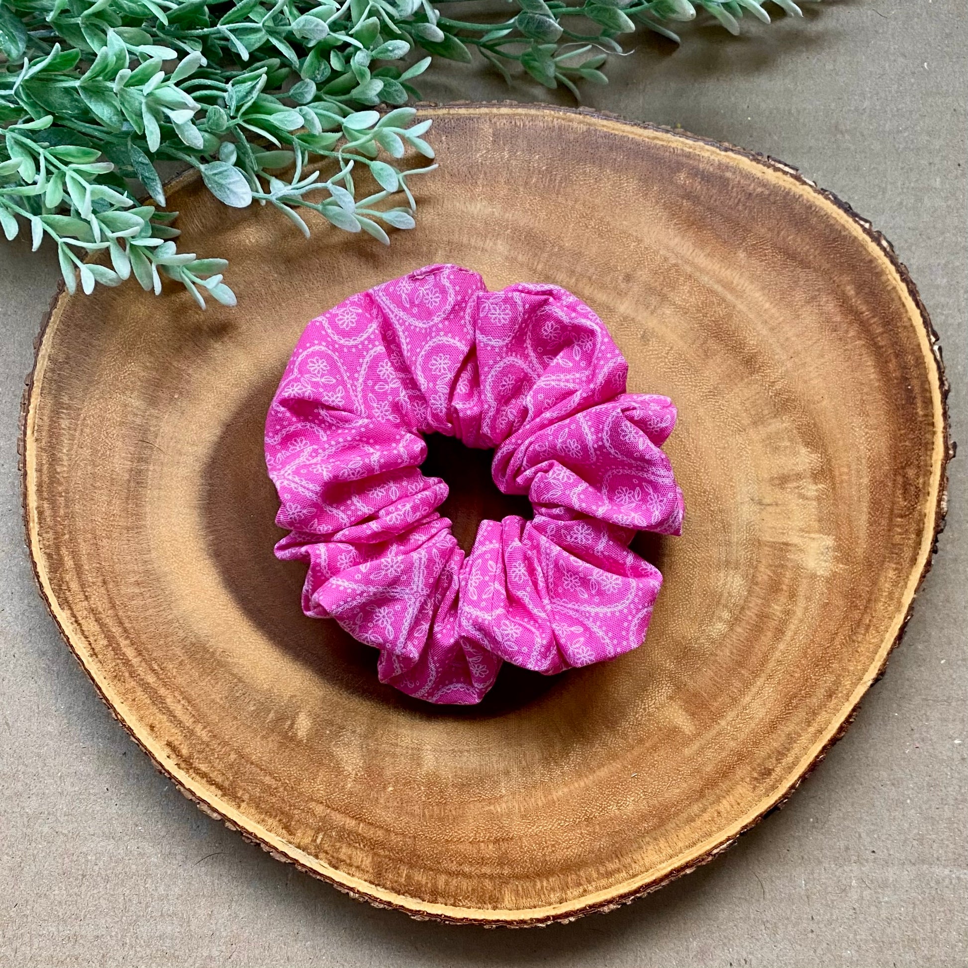 Pink Paisley cotton scrunchie by Bully Love Boutique, showing a close-up of the soft, patterned fabric wrapped around hair.