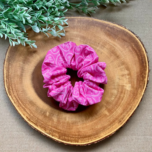 Pink Paisley cotton scrunchie by Bully Love Boutique, showing a close-up of the soft, patterned fabric wrapped around hair.