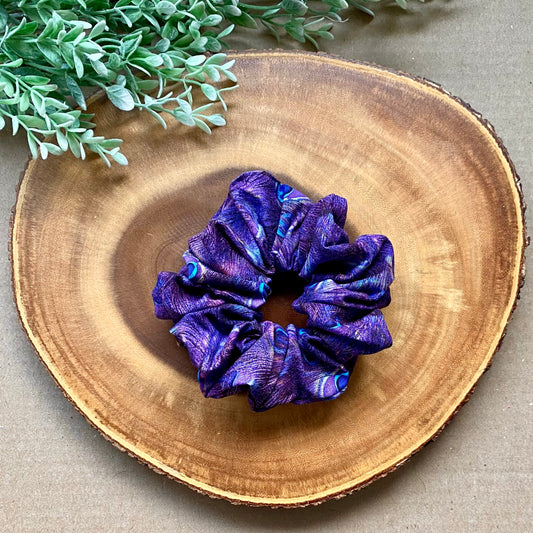 Peacock-colored cotton scrunchie from Bully Love Boutique, featuring soft fabric and elastic for hair styling.